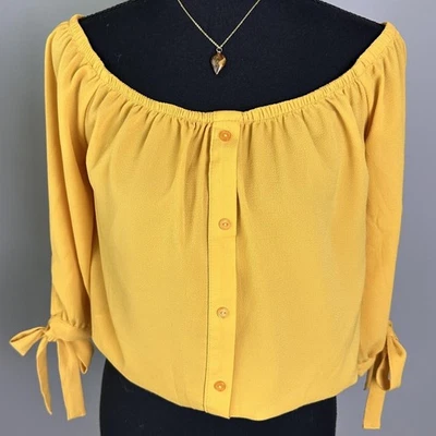 Camisa Campesina Mujer Pequeña Amarilla Fuera del Hombro Botón Delantero Manga 3/4 Recortada Foto 1 de 4