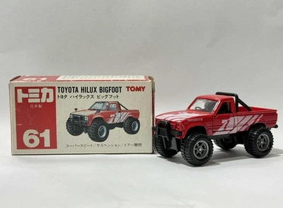 Tomica Caja Roja Japón Toyota Hilux Bigfoot Neumático Grande Hecho en Japón Como Nuevo No. 61 Foto 1 de 4