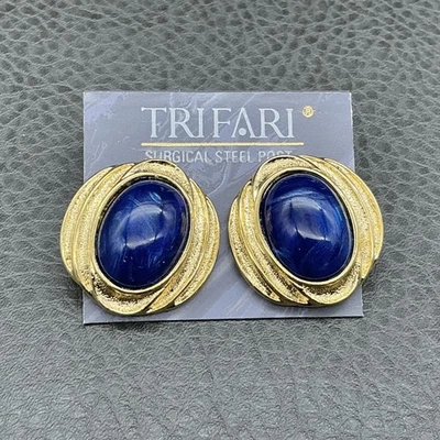 Pendientes Trifari Mujer Tono Dorado Azul Ovalado Cabujón Acero Quirúrgico Poste 1.25" Foto 1 de 4