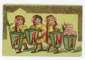 Antique ca. 1900's NEW YEARS GIRLS HOLDING HOLLY GREETING EMBOSSED POSTCARD - Picture 1 of 2