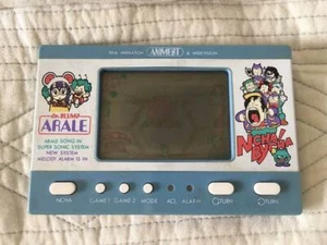 Reloj de juego Bandai POPY LCD Dr. Slump Arale Hoyoyo bombardero Ncha Bycha blanco y azul - Imagen 1 de 3
