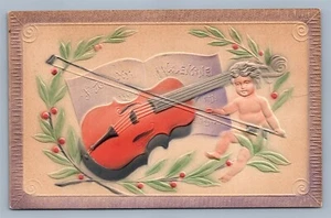 ANTIGUA POSTAL VALENTÍN EN RELIEVE CUPIDO con VIOLÍN Y NOTAS MUSICALES - Imagen 1 de 2