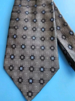 Corbata diseño platino color bronce con estampado geométrico con cuadrados azules Foto 1 de 4