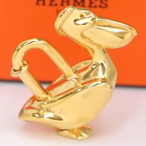 HERMES Pelikan Motiv Cadena Schloss Taschenanhänger Gold Original mit Box #0855 - Bild 1 von 5