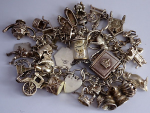 Georg Jensen vintage 105.9g solid silver charm bracelet,32 charms.opening,moving