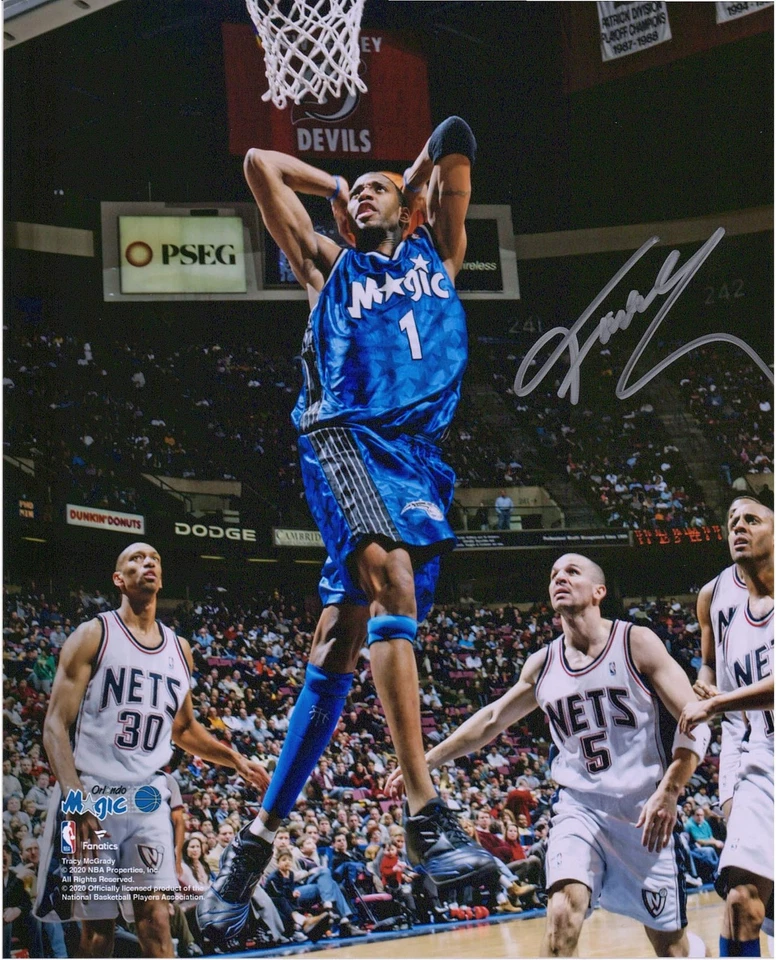 Foto firmada por Tracy McGrady Orlando Magic 8x10 a dos manos Dunk vs New Jersey Nets Foto 1 de 1