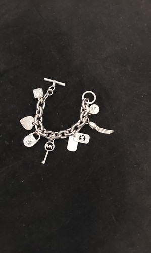 Bracciale Michael Kors tono argento pavè cristallo bianco ciondolo lungo 8"