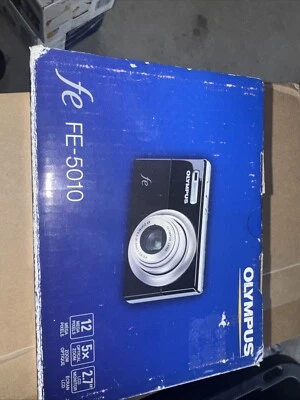 Pieza de puerta cubierta de batería genuina para cámara OLYMPUS FE-5010 FE5010 Foto 1 de 4