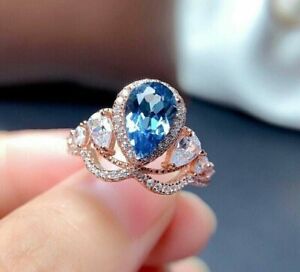 4 Ct Pear Cut Lab Created Blue Topaz Halo Crown Engagement Ring Rose Gold Plated