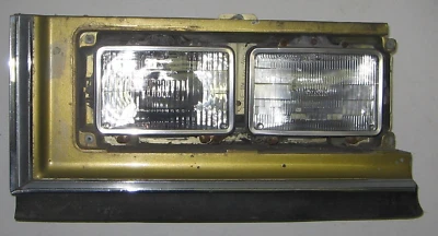 Cadillac Fleetwood Deville 1976 carcasa de faro LH con moldura usada original 75 76 Foto 1 de 4