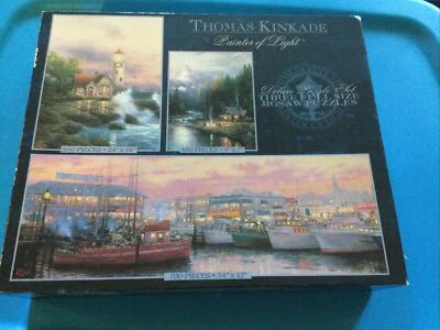 Thomas Kincade Jig Saw 3 Puzzle Set  New Sealed Box Buffalo Games Cottage Boat - Image 1 of 4