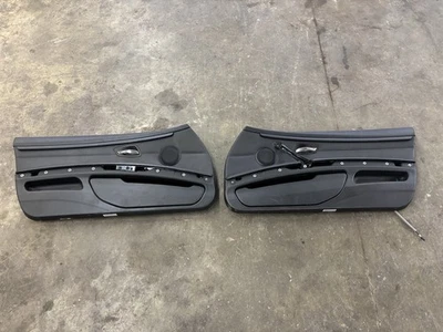 Пара черных кожаных внутренних передних дверных панелей BMW E92 335i 328i б/у от оригинального производителя в хорошем состоянии - Изображение 1 из 4