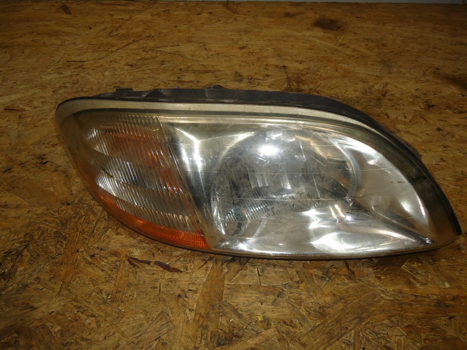 Faro izquierdo del lado del conductor Ford Windstar LH 2000 Foto 1 de 4