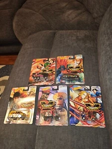 HOT WHEELS 2019 PREMIUM CAPCON STREET FIGHTER V SET OF 5 REAL RIDERS SEALED MOC - Picture 1 of 11
