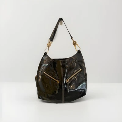 Bolso de hombro Dooney & Bourke charol negro con detalles dorados Foto 1 de 4