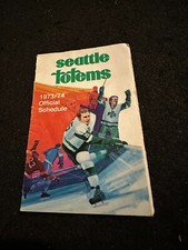 1973-74 WHL Seattle Totems Pocket Schedule unfolded Western Hockey League.