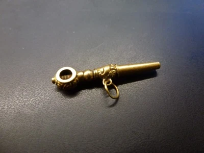 clef de montre,or 18 carats,poids brut 1,24g,poincon tete d'aigle sur anneau - Photo 1/3