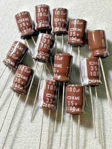 12X - Condensador electrolítico radial United Chemi-Con (KME) 100uF @ 35V 105° - Imagen 1 de 3