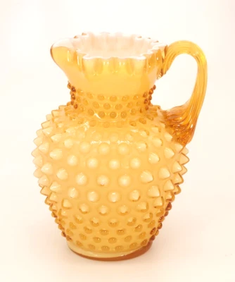 Fenton Art Glass Amber Hobnail White Overlay Pitcher - Image 1 of 4
