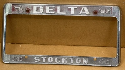 RARO PONTIAC/GMC “ DELTA” ( STOCKTON CA.) MARCO PLACA LICENCIA-VINTAGE Foto 1 de 4