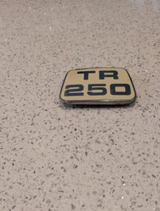 Triumph TR250 Beige Enamel & Chrome Bonnet Badge - Picture 1 of 3