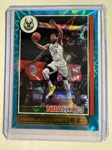 K149,381 - 2021-22 Hoops Teal Explosion #103 Giannis Antetokounmpo