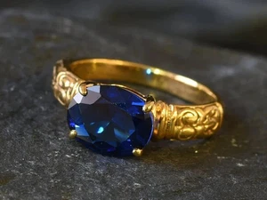 Anillo de boda de zafiro azul creado en laboratorio de corte ovalado de 2 quilates enchapado en oro amarillo de 14 k - Imagen 1 de 7