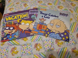 Rugrats Nickelodeon Lot Of 2 Books Vintage Vacation And Tommy Catches A Cold - Picture 1 of 1