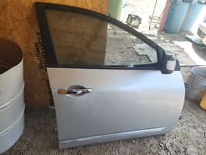2011 Rogue Right Passenger Side Front Door complete Color: Silver - Picture 1 of 1