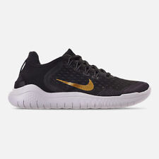 black nike with gold swoosh womens