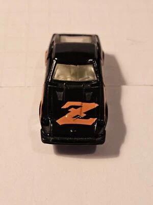 Matchbox Superfast Datsun Fairlady Z con calcomanía naranja Z y puertas de apertura  Foto 1 de 4