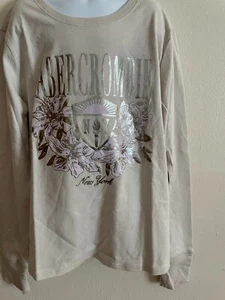 GIRL'S ABERCROMBIE KIDS LONG SLEEVE, CREW NECK SHINY LOGO T-SHIRT SIZE 13/14 NWT - Picture 1 of 2