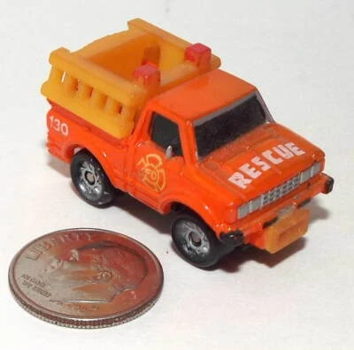 Small Micro Machine Datsun Fire Truck in Orange Marked number 130 # 2 - Image 1 of 3