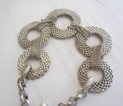 Pulsera círculo malla plata Kenneth Cole Foto 1 de 3