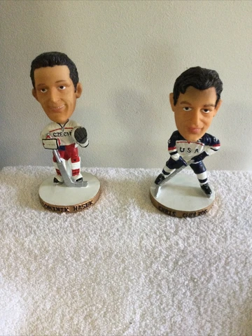 Chris Chelios  Plus  Dominik Hasek Bobble Heads From Olympics Cover