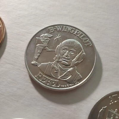 MONEDA ORIGINAL 1984 STAR WARS B-WING PILOTO REBEL METAL PLATA KENNER DE COLECCIÓN 1 Foto 1 de 3