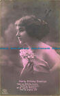 R642483 Hearty Birthday Greetings. Woman with a flower in her hands. Amag. 1915