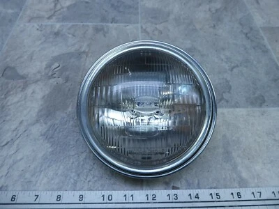 Suzuki GN125 S254-1 1983. Faro Koito y anillo de ajuste Foto 1 de 4