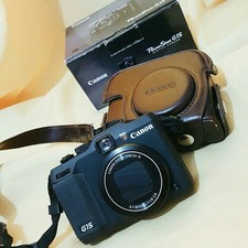 Canon G15 (with leather case)