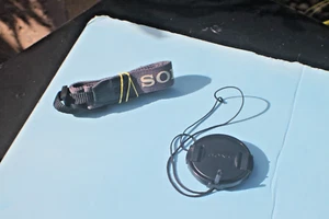 SONY - H5 - OBJEKTIVABDECKUNG - GURT - OEM - Bild 1 von 3
