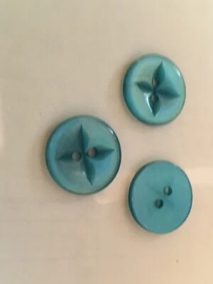 12 PC PKG. NEW 3/4 INCH  AQUA PEARL FINISH STAR DESIGN BUTTON - Image 1 of 3