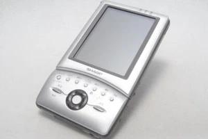 SHARP Zaurus MI-E1 Set PDA Assistant Numérique Personnel Fonctionnement Confirmé Rare - Photo 1 sur 9