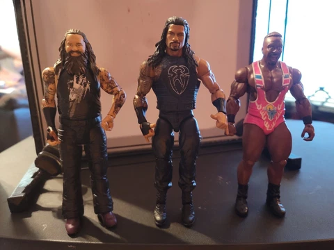 WWE Mattel Elite Roman Reigns, Basic Bray Wyatt, and Basic Big E Cover