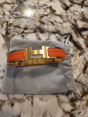 Pulsera Hermes Clic H rara acento naranja - oro amarillo auténtica  Foto 1 de 4