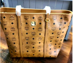 AUTH NWT MCM Women’s Aren Medium Zip Top Coated Canvas Shopper Tote In Cognac - Picture 1 of 8