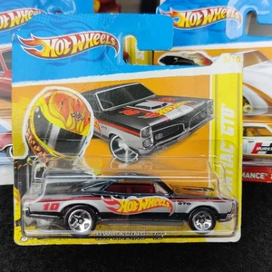 AUTO HOT WHEELS '67 PONTIAC GTO NERO HW RACING 12 3/10 173/247 1:64 NUOVO - Foto 1 di 6