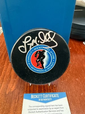 Lanny McDonald Salón de la Fama Logo Puck Beckett Certificado de Autenticidad Foto 1 de 3