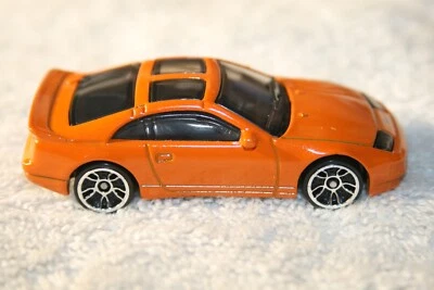 HOT WHEELS 💥 NISSAN 300ZX 1996 NARANJA DOBLE TURBO 💥 LLANTAS CROMADAS DOBLE TECHO CORREDIZO Foto 1 de 4