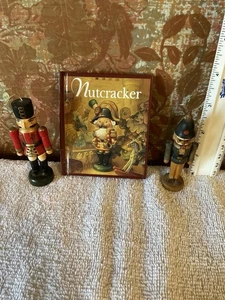 Lot 57 - 3 Items - Nutcracker Book, Ornament, & Miniature Wooden Nutcracker - Picture 1 of 15