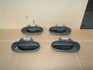 Manija de puerta exterior delantera/trasera Nissan Almera N16 2001 plástico negro única - Imagen 1 de 1